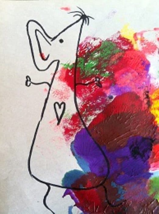 Connie's hand-drawn Art Mouse standing in a splash of paint